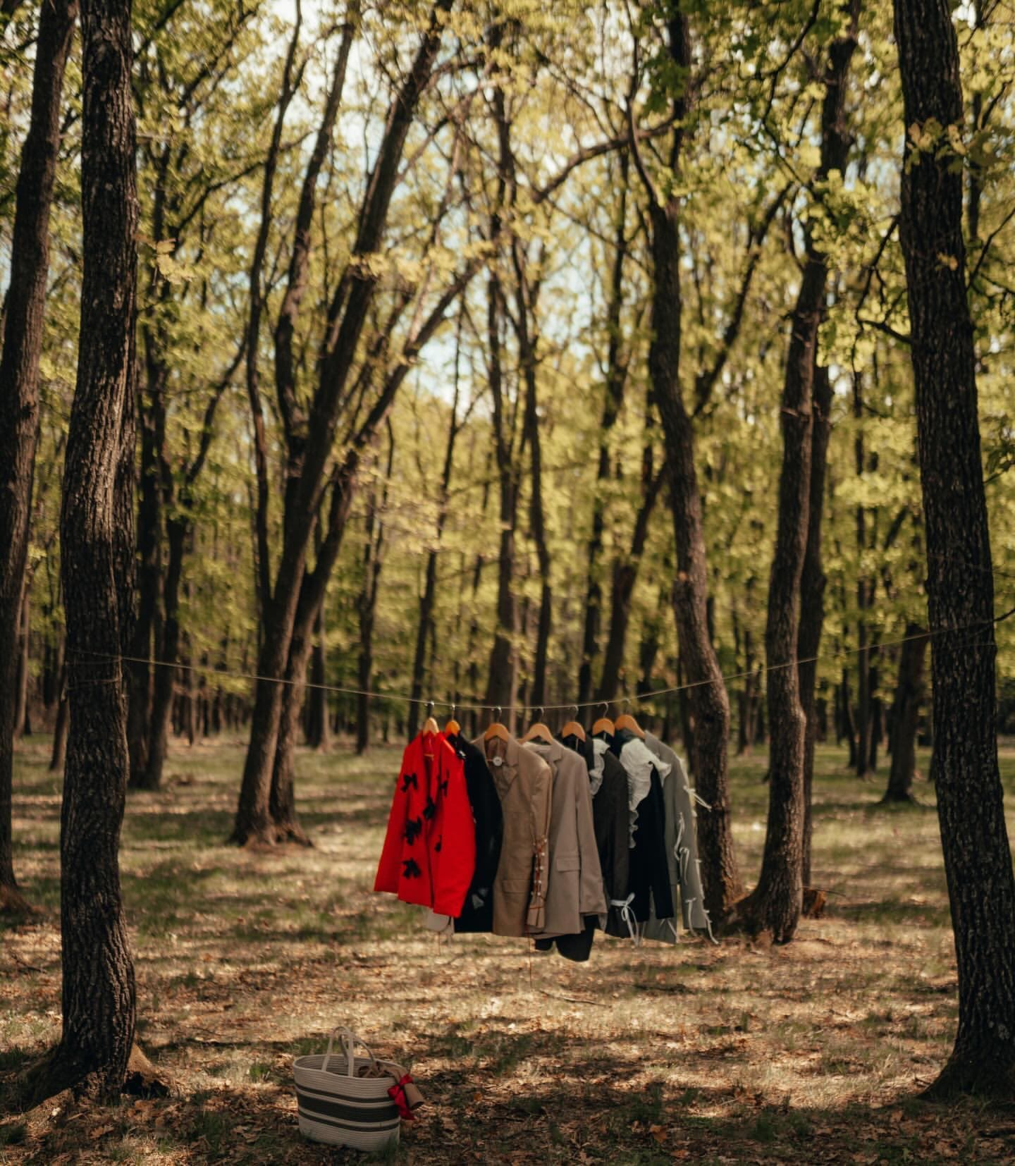 The re.born collection, hung on a line between trees in the forest near Cluj-Napoca